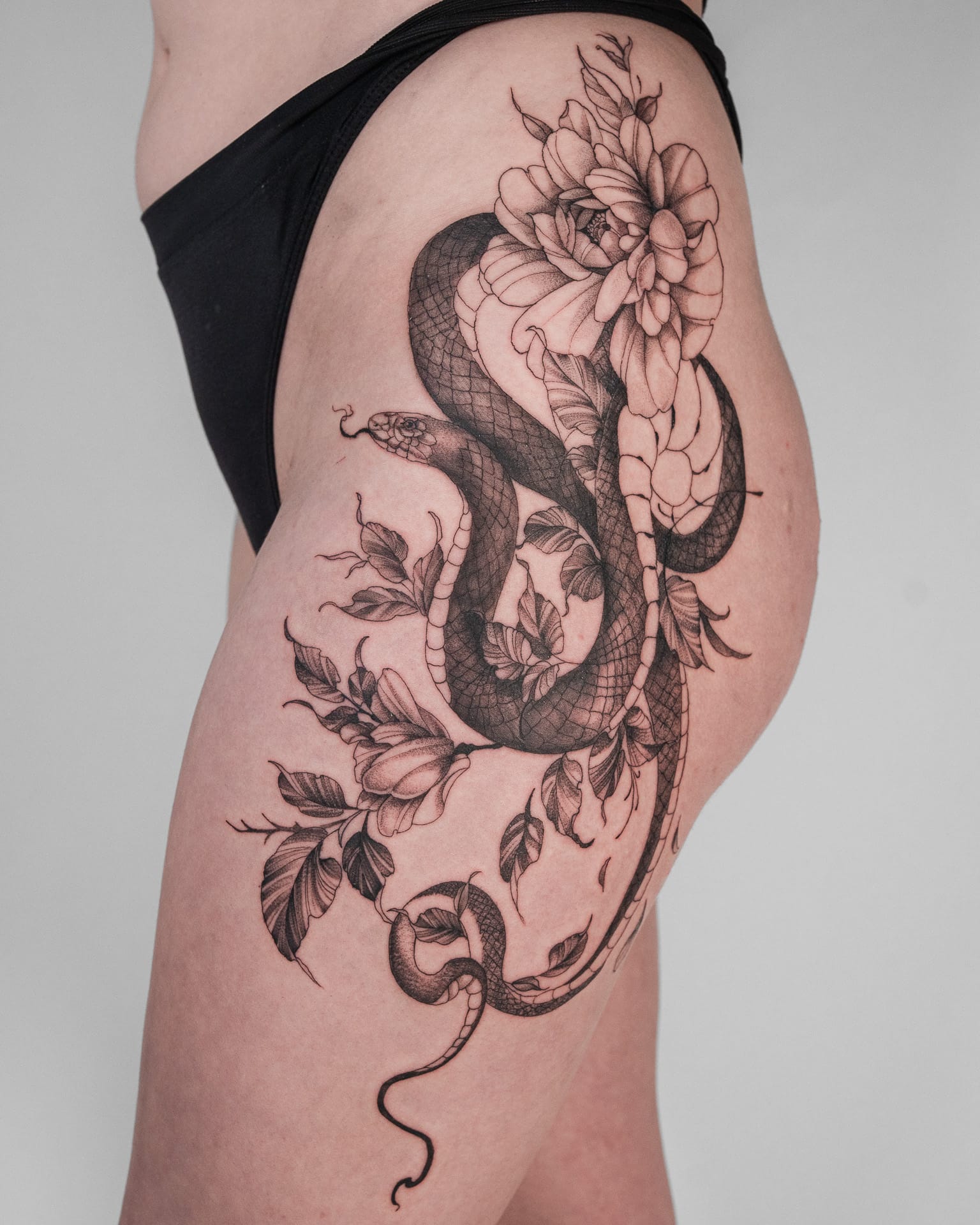 Fine line botanical tattoo — statement piece