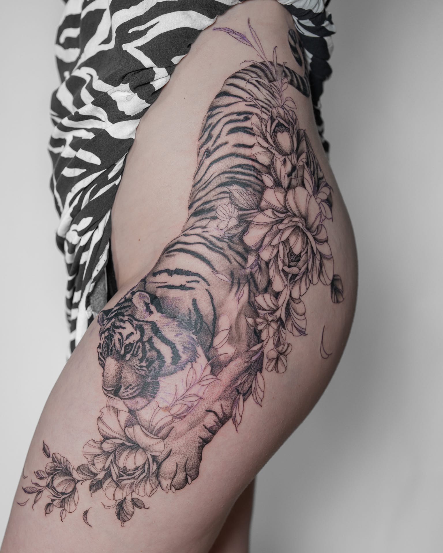 Fine line botanical tattoo work in Málaga