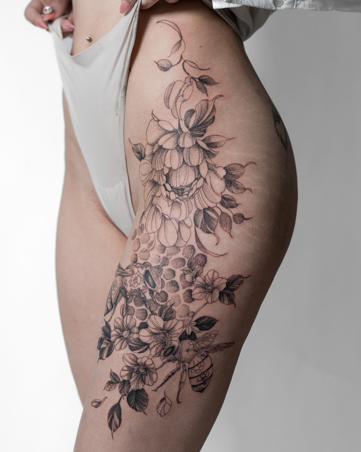 Fine line tattoo — botanical close-up
